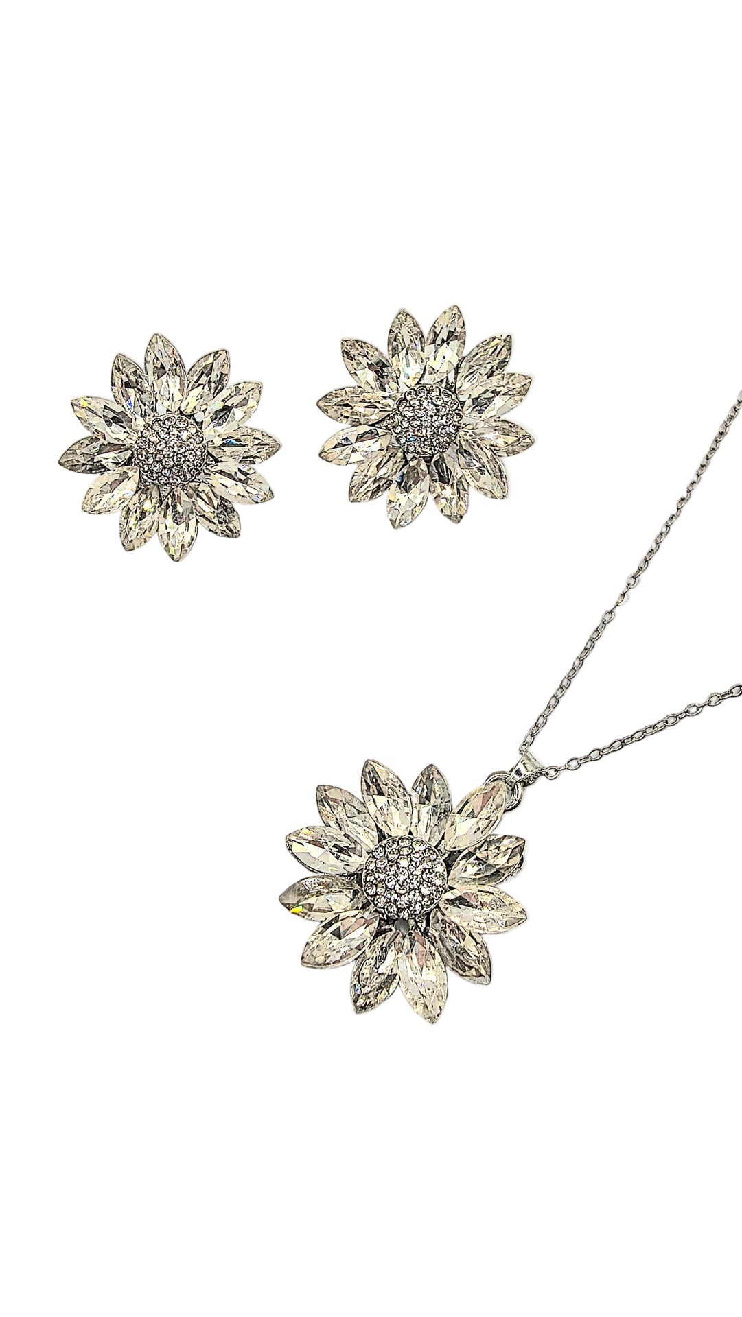 Sunflower-shaped silver jewelry set with necklace and earrings on a light gray background