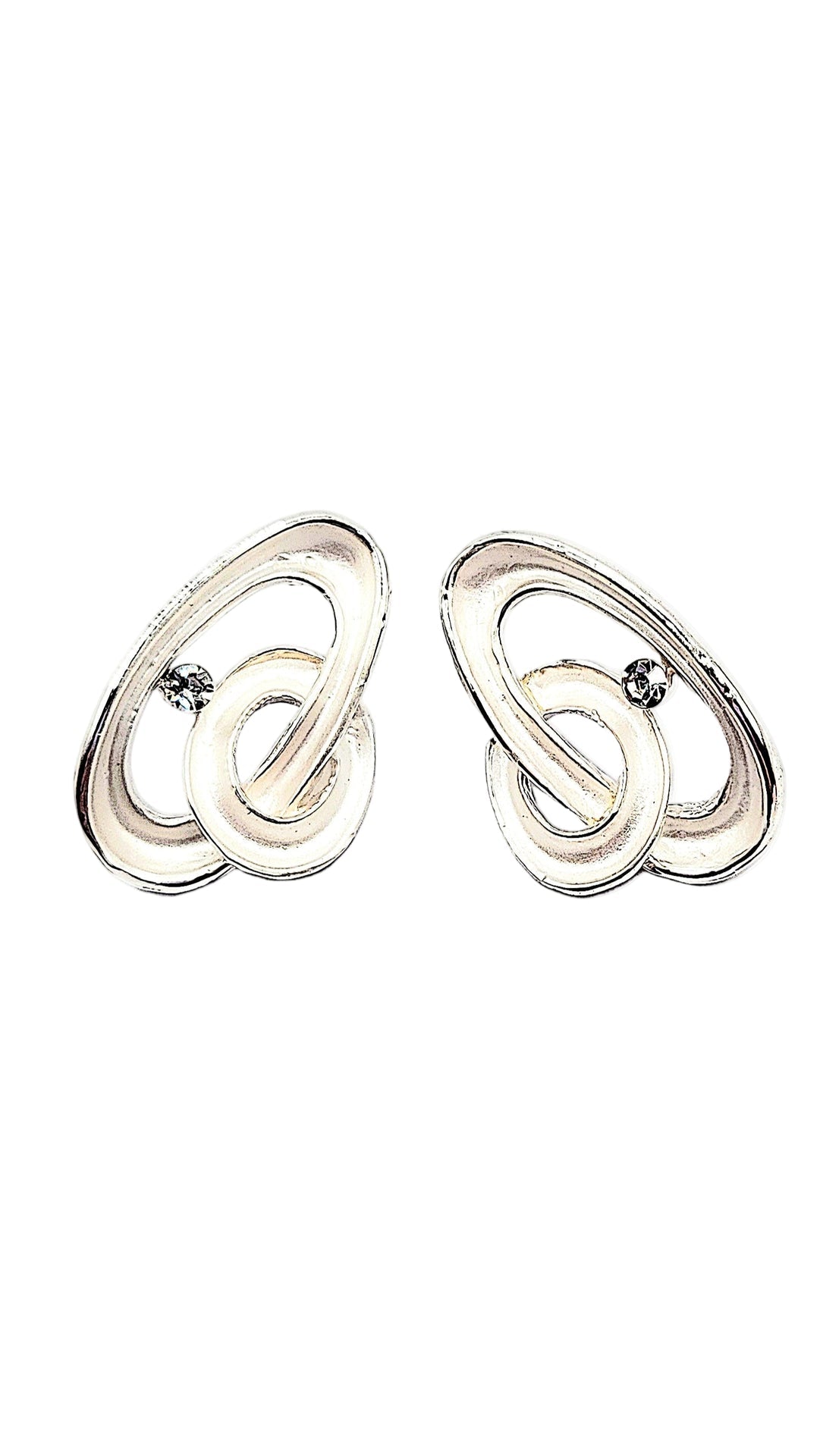 Pair of silver earrings on a white background