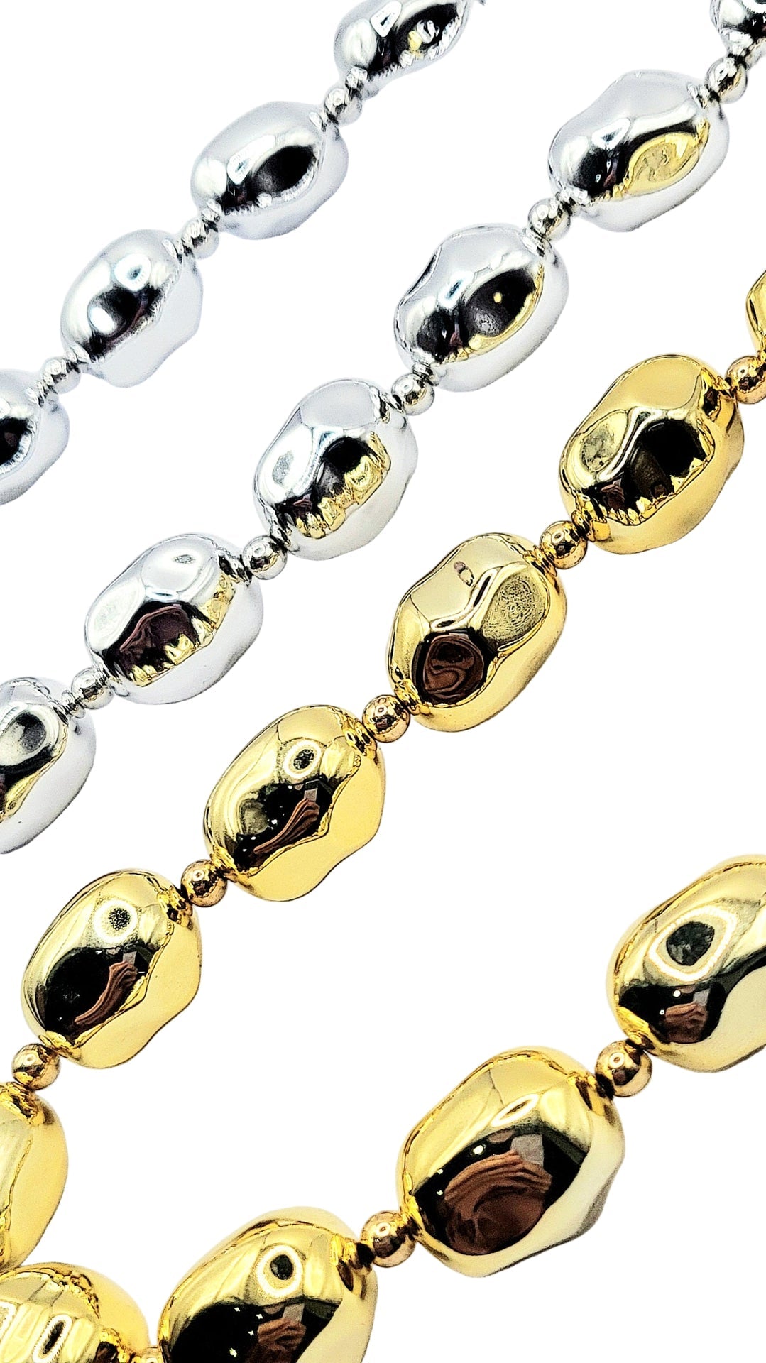 Close-up of gold and silver beaded necklaces on a white background