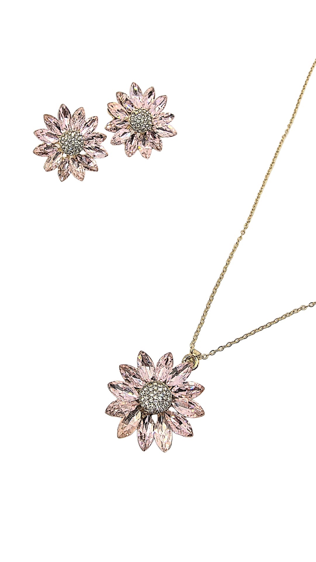 Pink floral necklace and earrings on a light gray background