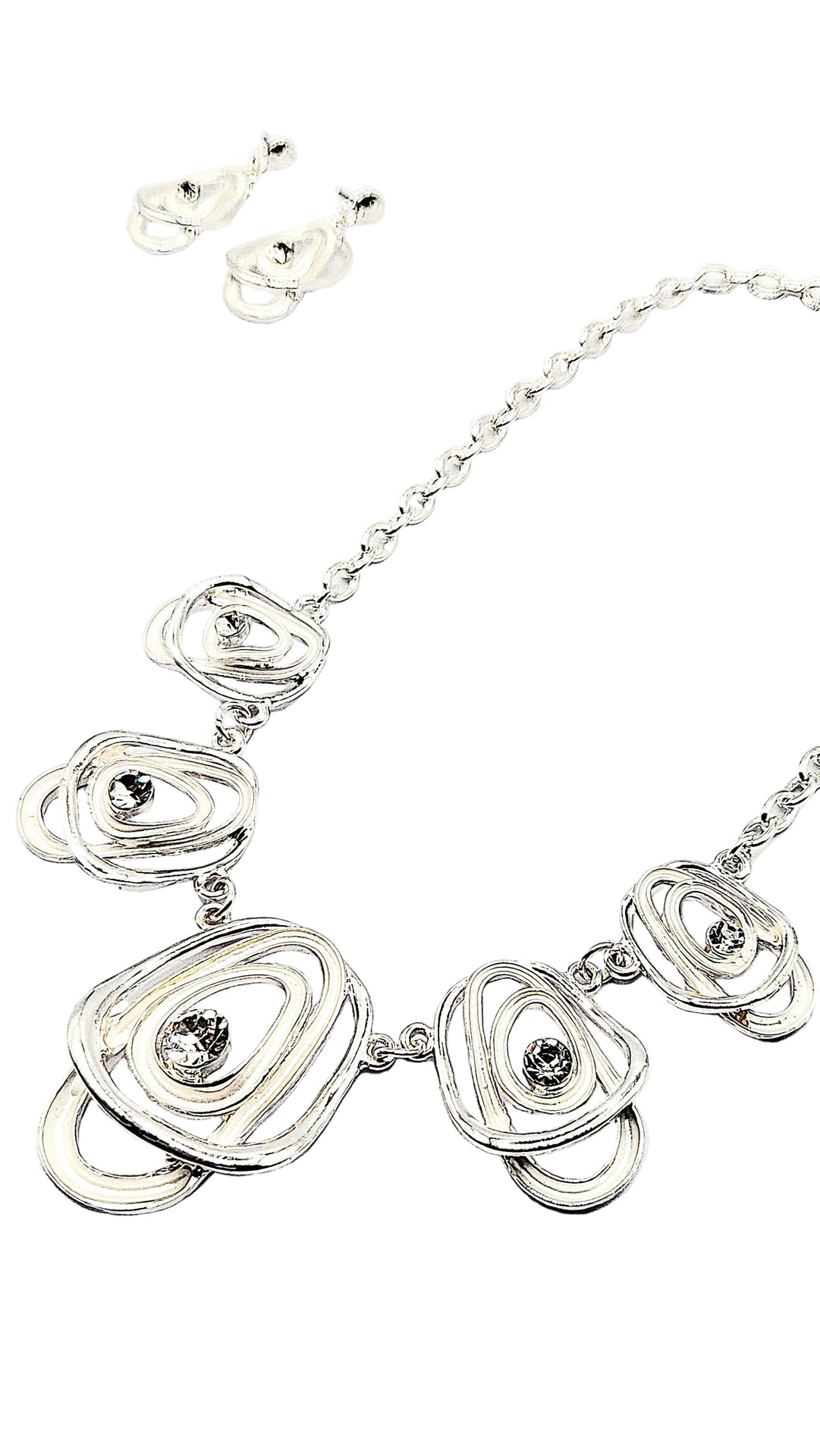 Silver necklace with floral designs and embedded stones on a white background