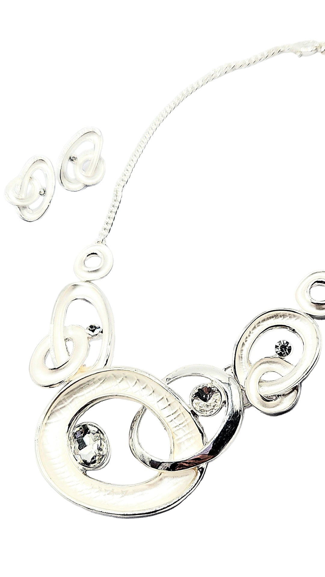 Silver necklace with circular links and embedded stones on a white background