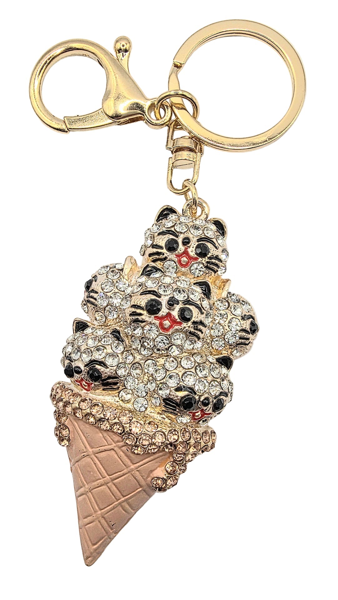 Keychain shaped like a ice cream cone with cat faces on a white background